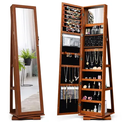 A jewelry cabinet with a full-length mirror is shown open, displaying its interior storage compartments filled with jewelry and cosmetics. The cabinet is made of wood and has a brown finish. The mirror reflects a potted plant and a window.