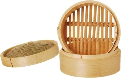 Produktbild von Bamboe entferne ich als Marke. Übersetzung: "Dampfsteamer für Fisch, Gemüse und Dumplings aus Bambus" Bambus Dampfsteamer für Fisch, Gemüse und Dumplings