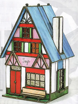 Tiffanyhaus im freundlichen hellen Farbschema roten, rosa, weißen und grünen Elementen blaues Dach.