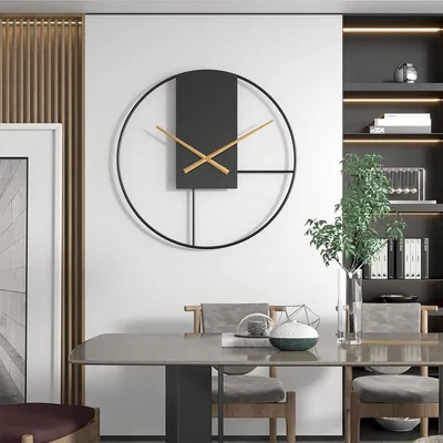 A modern dining room with a large wall clock, dining table, and chairs.