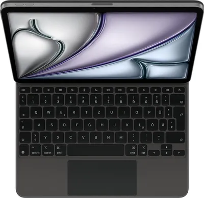A top-down view of an open laptop with a dark gray keyboard and a dark gray trackpad. The screen displays a colorful abstract image.