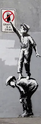 Produktbild von Graffiti auf Plakaten mit Brandzeichen ist eine Straftat