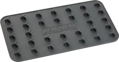 A gray ironing mat with raised hexagonal nubs.