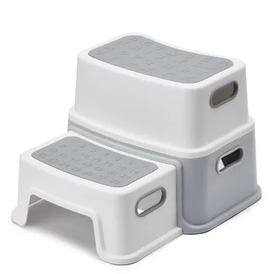 A two-step stool for children, shown against a white background.