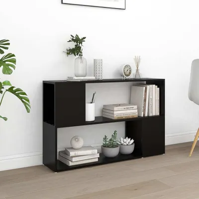 A black bookshelf with books and decorative items on it, placed against a white wall.