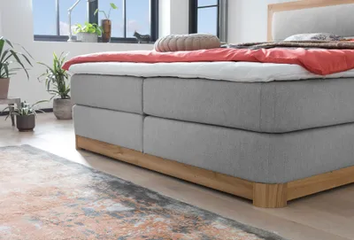 Produktbild von Belanoti Age Boxspringbett 180x200 Eiche 7-Zonen Taschenfederkern Matratze inkl Visco Topper Bett 180x200 in der Farbe Hellgrau H2/H3 Polsterbett Hotelbett mit Massivholz Eiche Massivholzbett