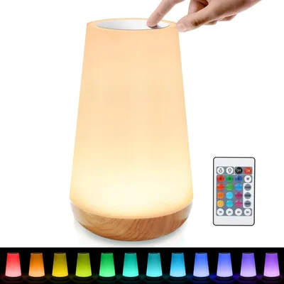 A touch-sensitive LED nightstand lamp with a wooden base, shown with a remote control and a spectrum of color options displayed below.