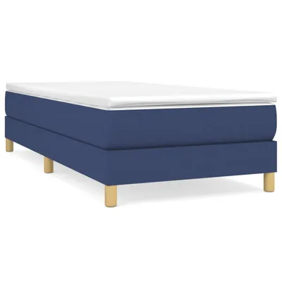 A studio shot of a blue boxspring bed frame with a white mattress topper and wooden legs, presented against a white background.