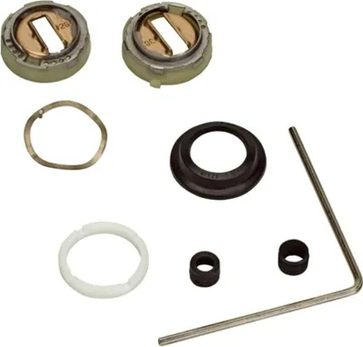 A collection of plumbing parts laid out on a white background.