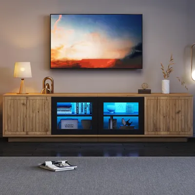 Immagine prodotto di Mobile TV a basso profilo da 180 cm, adatta per televisori da 75 pollici, con quattro ante, vetro temperato e illuminazione LED controllabile tramite app, con finitura effetto legno naturale