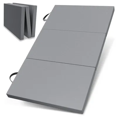 A folded and unfolded gray mattress on a white background.