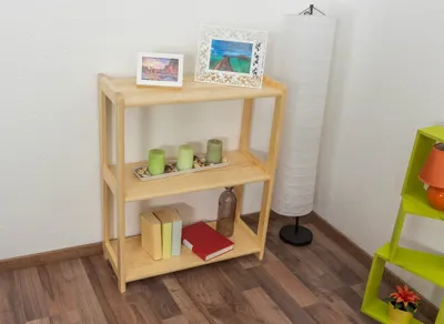 A wooden shelf unit with decorative items and books.