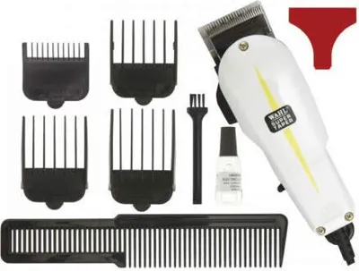 A collection of hair clippers and accessories laid out on a white background.