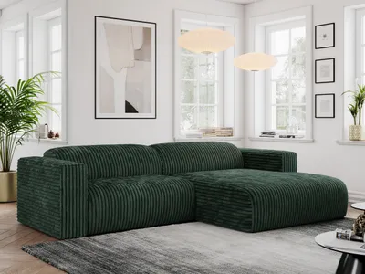 A modern living room with a green corduroy sectional sofa.