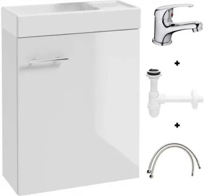 A white bathroom vanity with a sink, faucet, and plumbing parts displayed next to it.