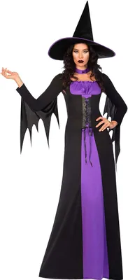 A woman wearing a witch costume against a white background.