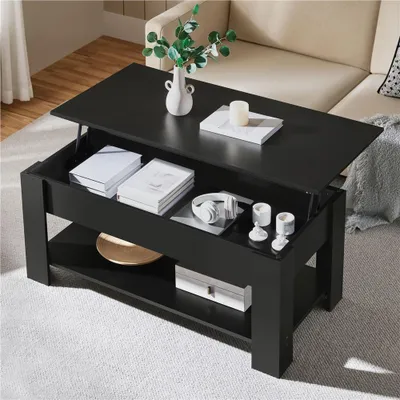 A black lift-top coffee table with storage, set in a living room with a sofa in the background.