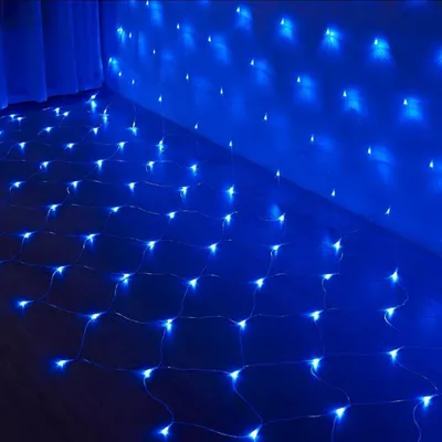 A net of blue LED lights is draped over a floor and up a wall, creating a decorative lighting effect.