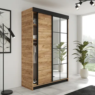 A modern wardrobe with sliding doors and mirrored panels in a room setting.