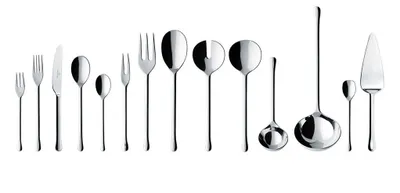 A collection of silverware arranged in a line against a white background.
