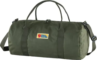 A green duffel bag is shown against a white background.