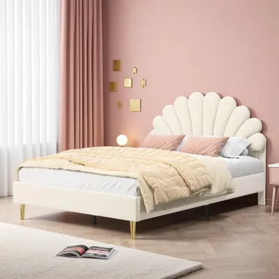 A bedroom scene with a bed, curtains, and wall decorations.