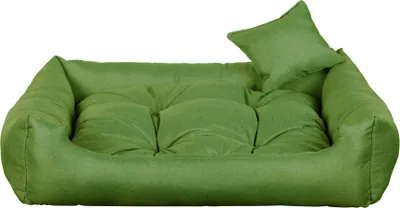 A green dog bed with a small pillow on a white background.