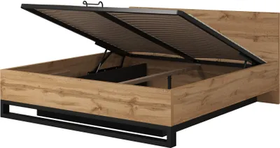 A bed frame with the storage compartment open, showing the lift mechanism and slatted base.