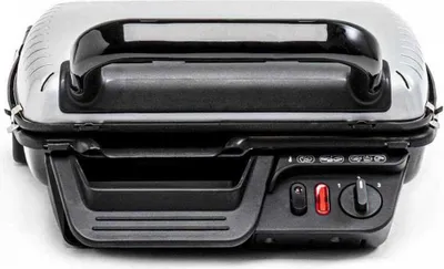 A close-up, front-facing view of a closed Tefal contact grill on a white background.