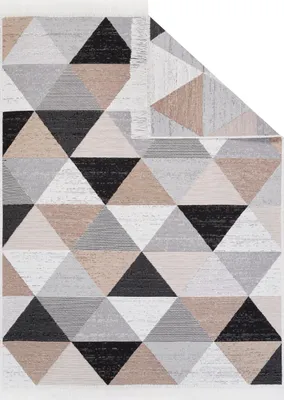 A rug with a geometric triangular pattern is shown laid out flat.