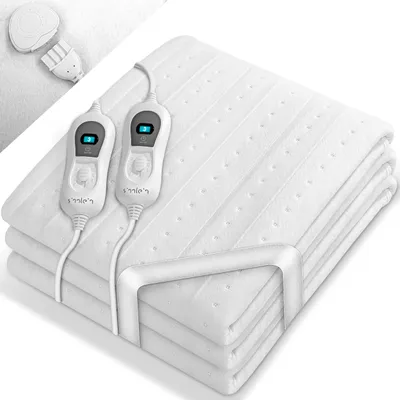 A folded white electric blanket with two controllers is shown on a white background.