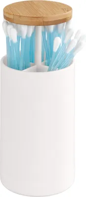 A white ceramic holder with a bamboo lid filled with blue-tipped cotton swabs.