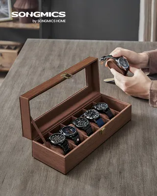 Produktbild von SONGMICS Uhrenbox mit 6 Fächern, Uhrenkasten mit Glasdeckel, Aufbewahrungsbox als Geschenk, Kunstleder, mit Uhrenkissen, 30 x 11 x 8 cm, braun mit Holzmaserung JWB006K01