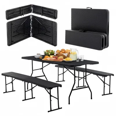 A black folding picnic table and bench set is displayed, with some food items on the table.