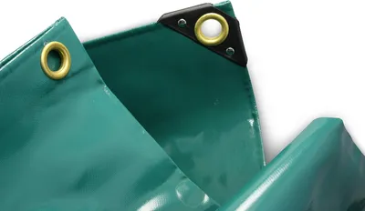 Close-up view of the corner of a green tarp, showing reinforced grommets.