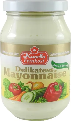 A jar of mayonnaise with vegetables depicted on the label.
