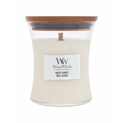 A WoodWick White Honey candle in a glass jar with a wooden lid.