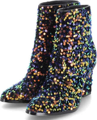 A pair of black ankle boots covered in colorful sequins.