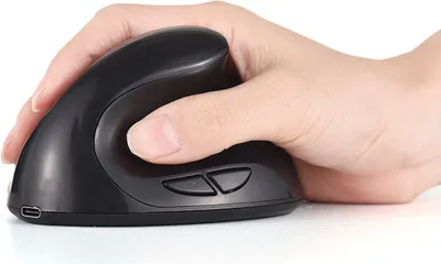 A hand holding a black vertical mouse.