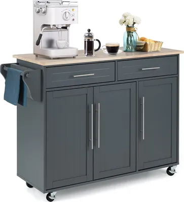 A kitchen cart with a coffee maker and coffee on top.
