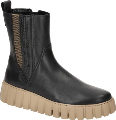 A black leather chelsea boot with a tan platform sole, shown from a side angle against a white background.