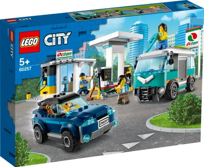 LEGO City gas station playset with vehicles and minifigures.