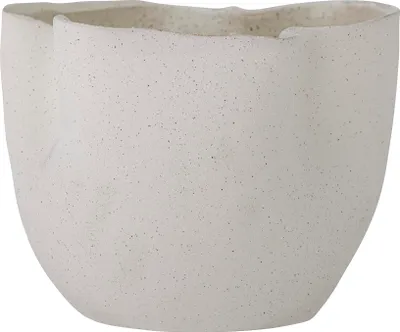 A white ceramic pot with a textured surface.