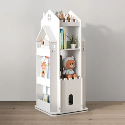 A white, castle-shaped bookshelf filled with books and a teddy bear.