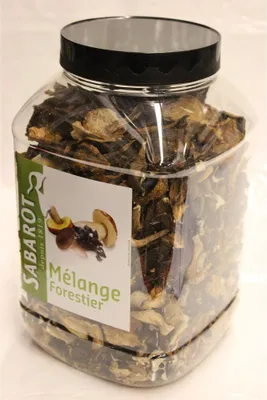 A clear, well-lit studio shot of a plastic jar filled with dried forest mushrooms, with a prominent label on the front.