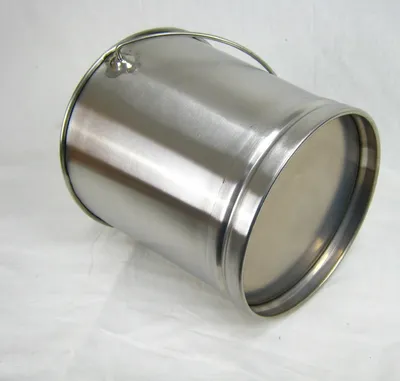A stainless steel bucket is shown on a white surface.