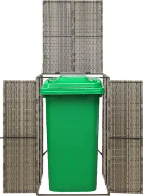 A green trash bin inside a gray poly rattan enclosure.