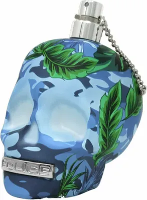 A perfume bottle shaped like a skull with a camouflage and jungle leaf design.