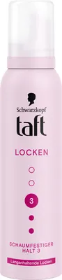 A pink aerosol can of hair mousse for curls.