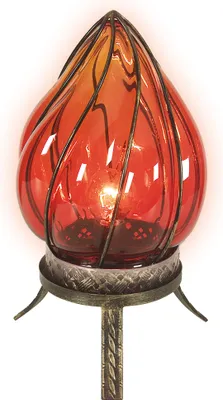 A close-up studio shot of a decorative table lamp with a red glass shade and a metal base.